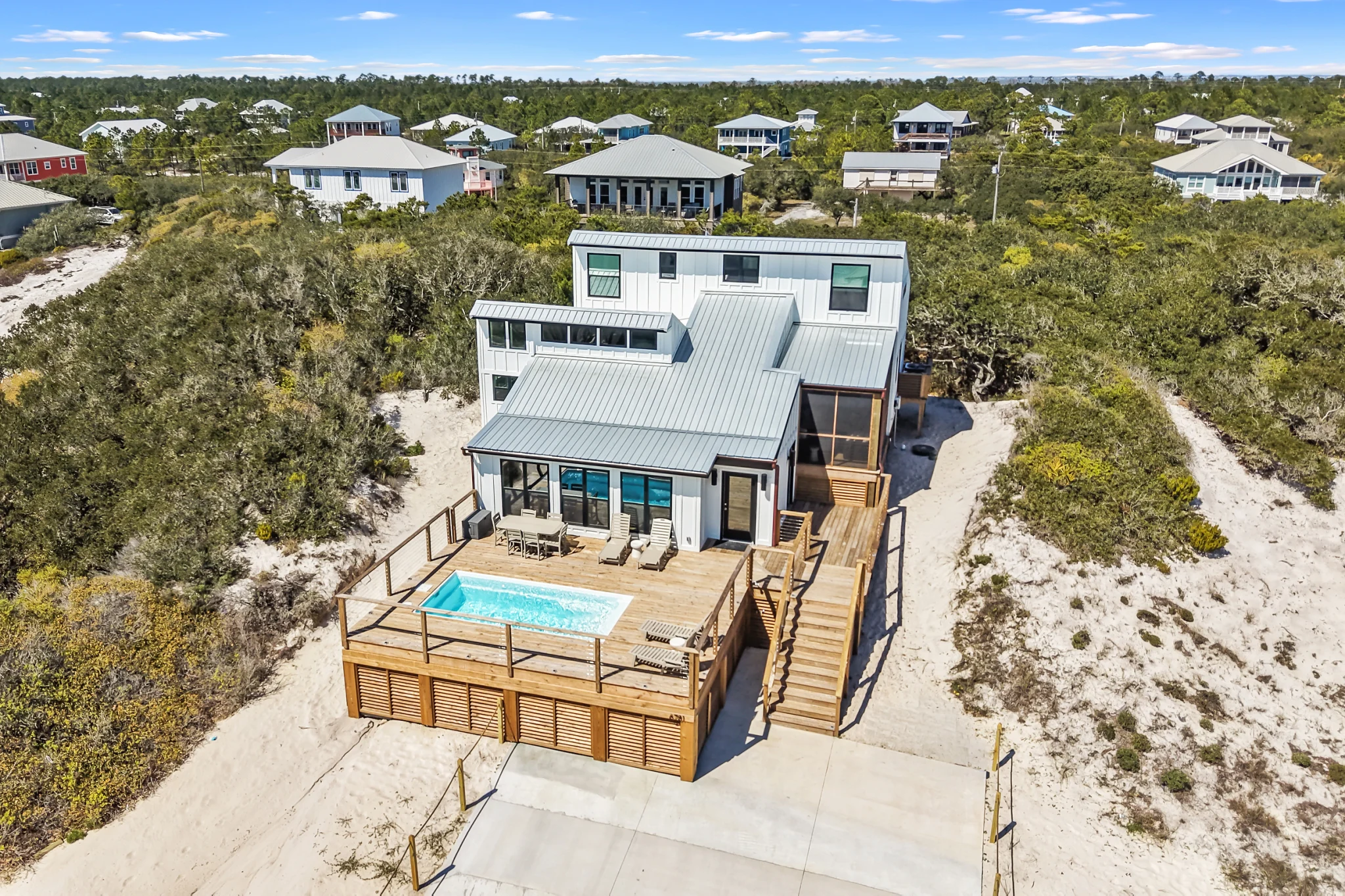 House and pool deck from the air, Love Shack