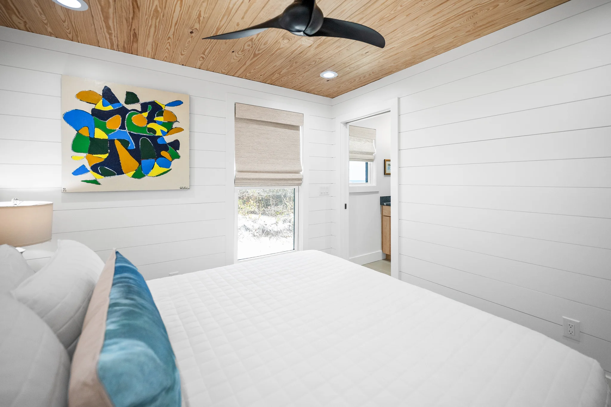 Queen bedroom with colorful art, Love Shack