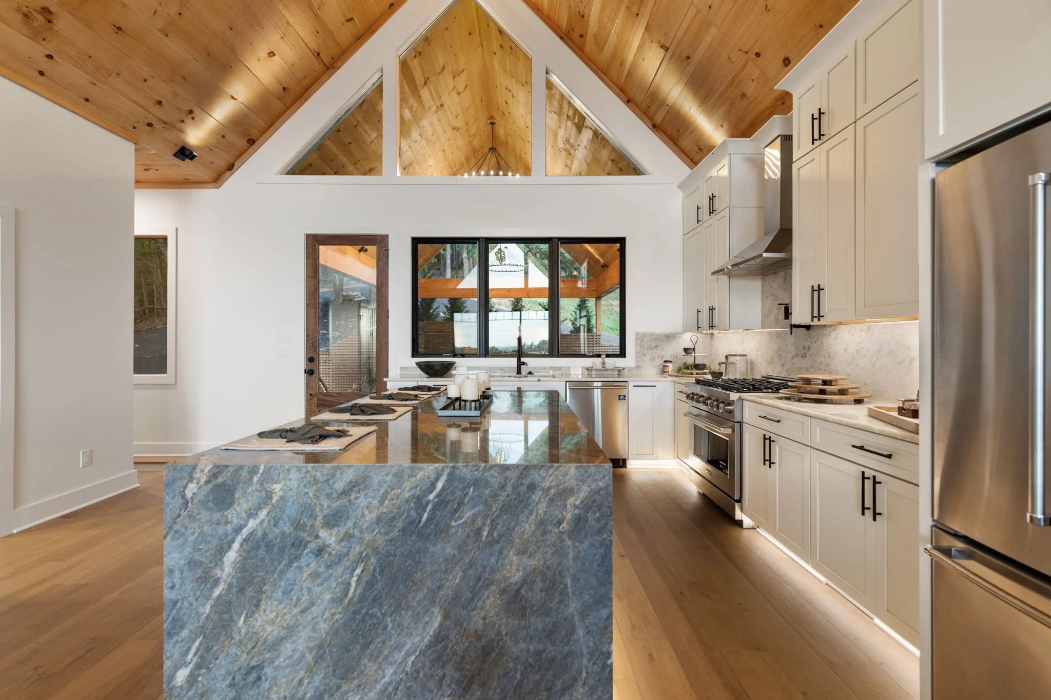 Chef's kitchen with a large stone island, View Finder I