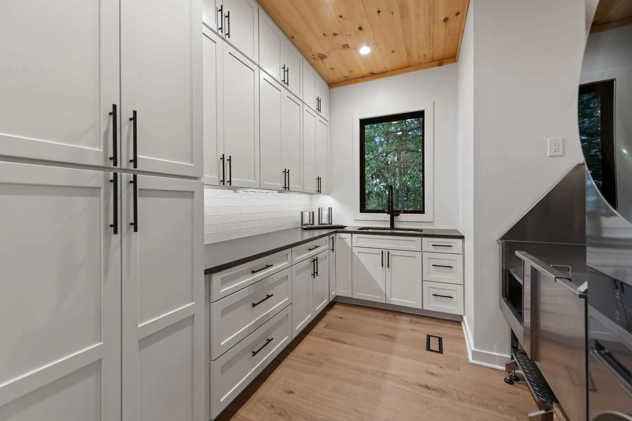Laundry room with a stacked washer and dryer, View Finder I