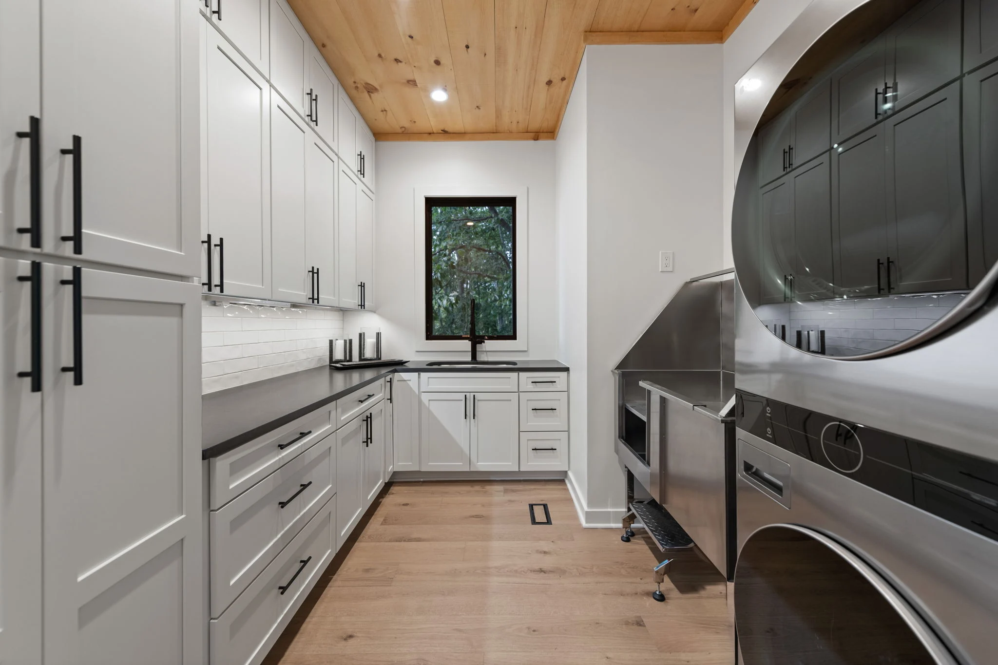 Laundry room with a stacked washer and dryer, View Finder I