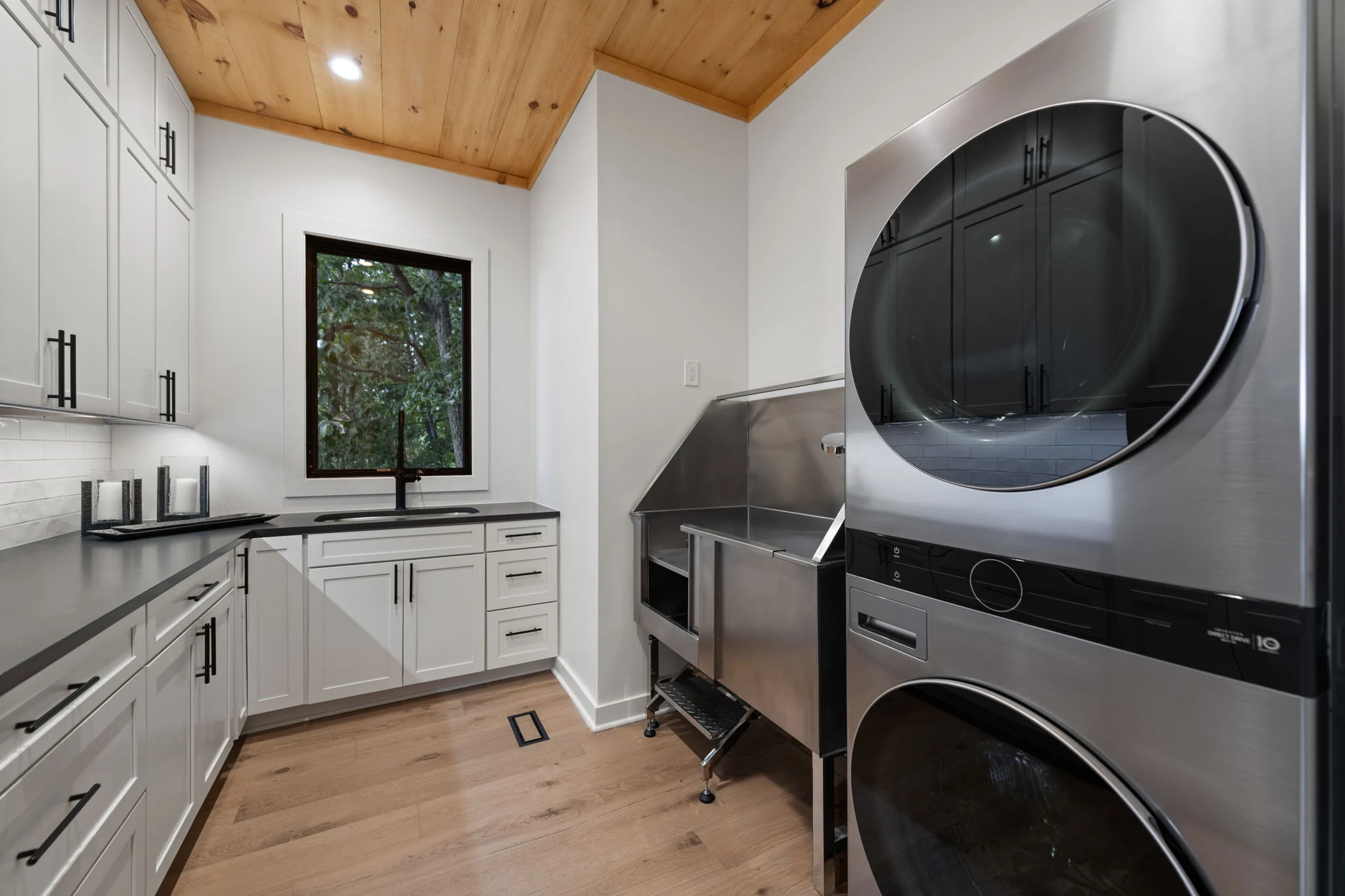 Laundry room with a stacked washer and dryer, View Finder I
