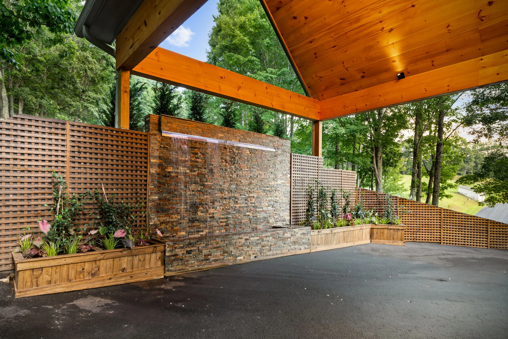 Covered entry with a stone water wall, View Finder I
