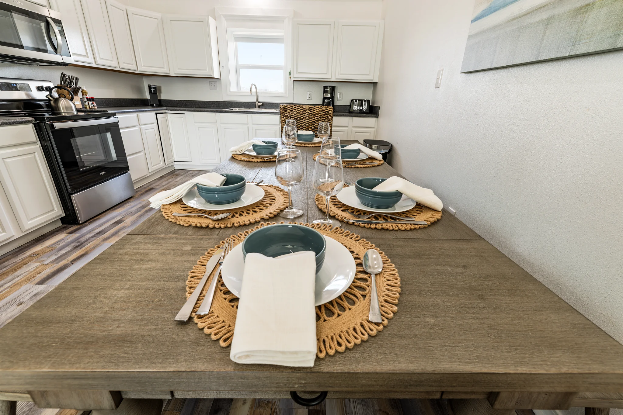 Long dining table set for a meal, Sands of Time