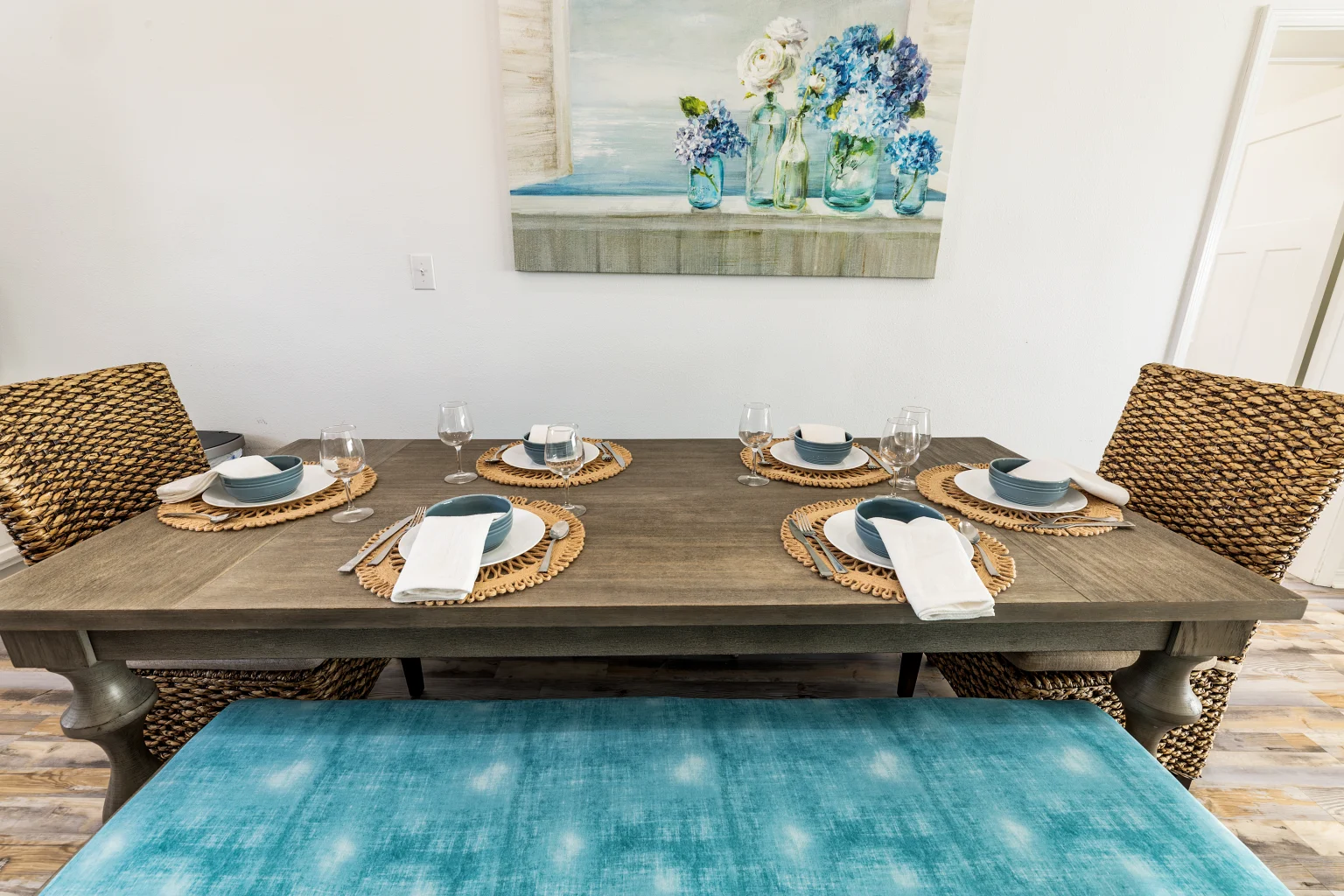 Dining table set with blue plates, Sands of Time
