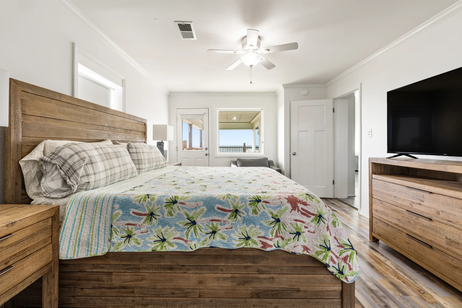 King bedroom with wood bed and TV, Sands of Time