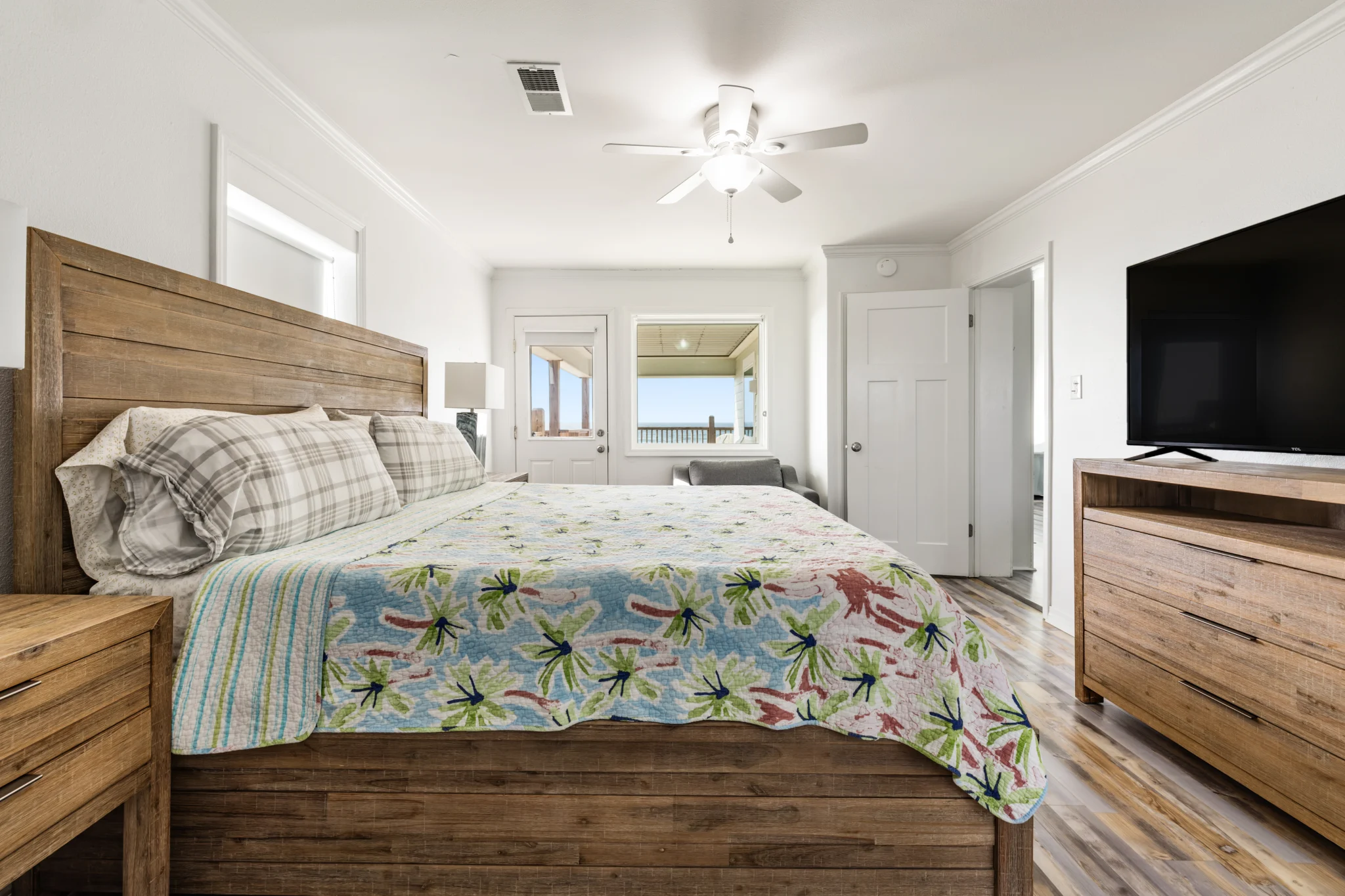 King bedroom with wood bed and TV, Sands of Time