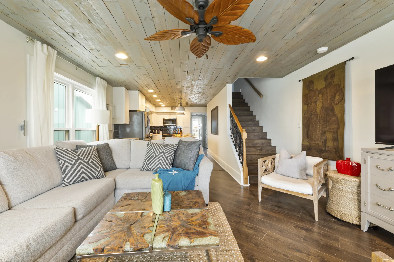 Living room with sectional, open to the kitchen and stairs, SouthWind West