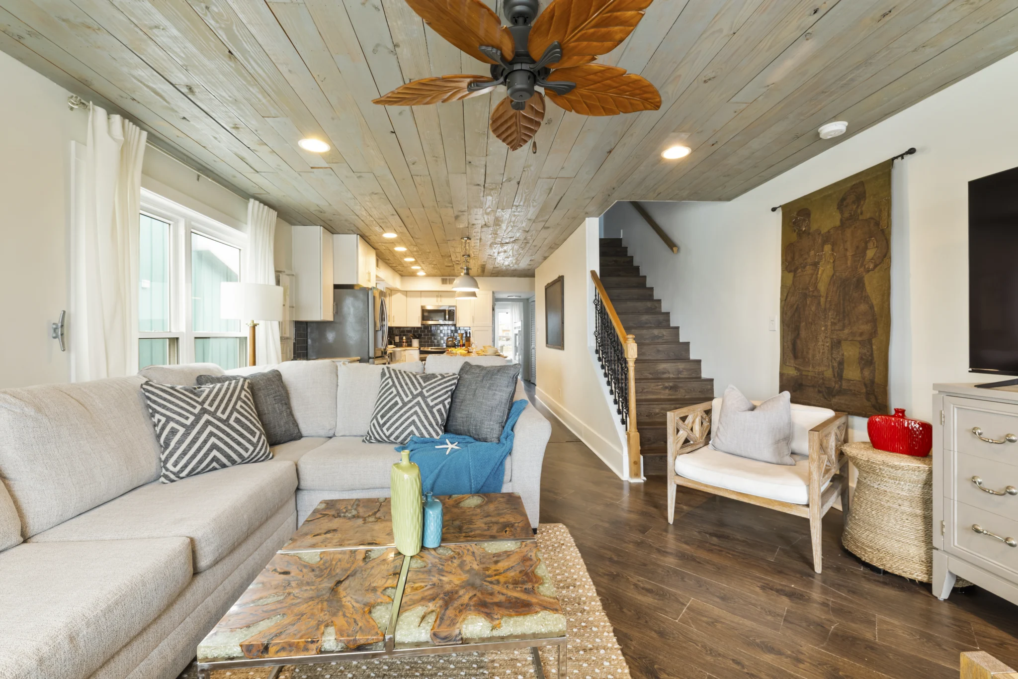 Living room with sectional, open to the kitchen and stairs, SouthWind West