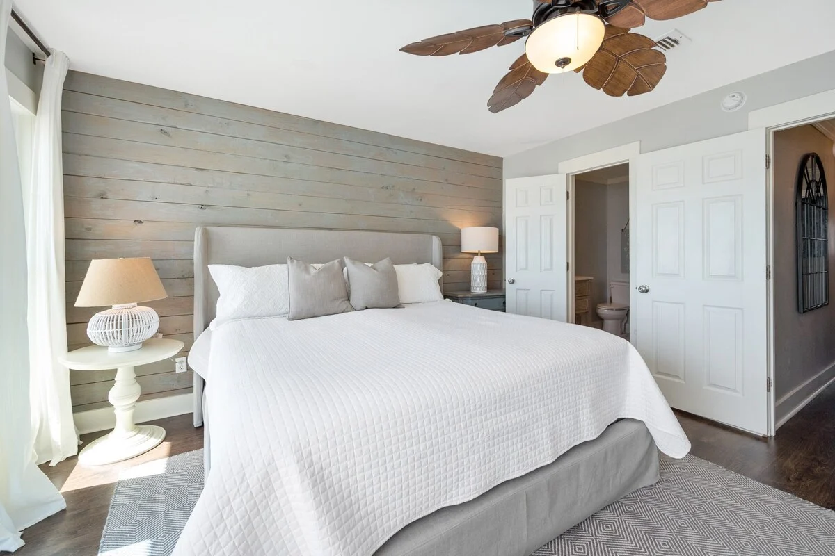 King bedroom with shiplap wall, SouthWind West