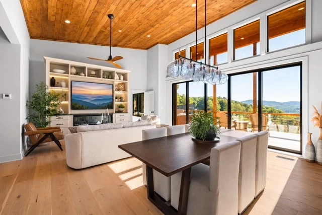 Living and dining area with the TV wall and deck doors, View Finder II