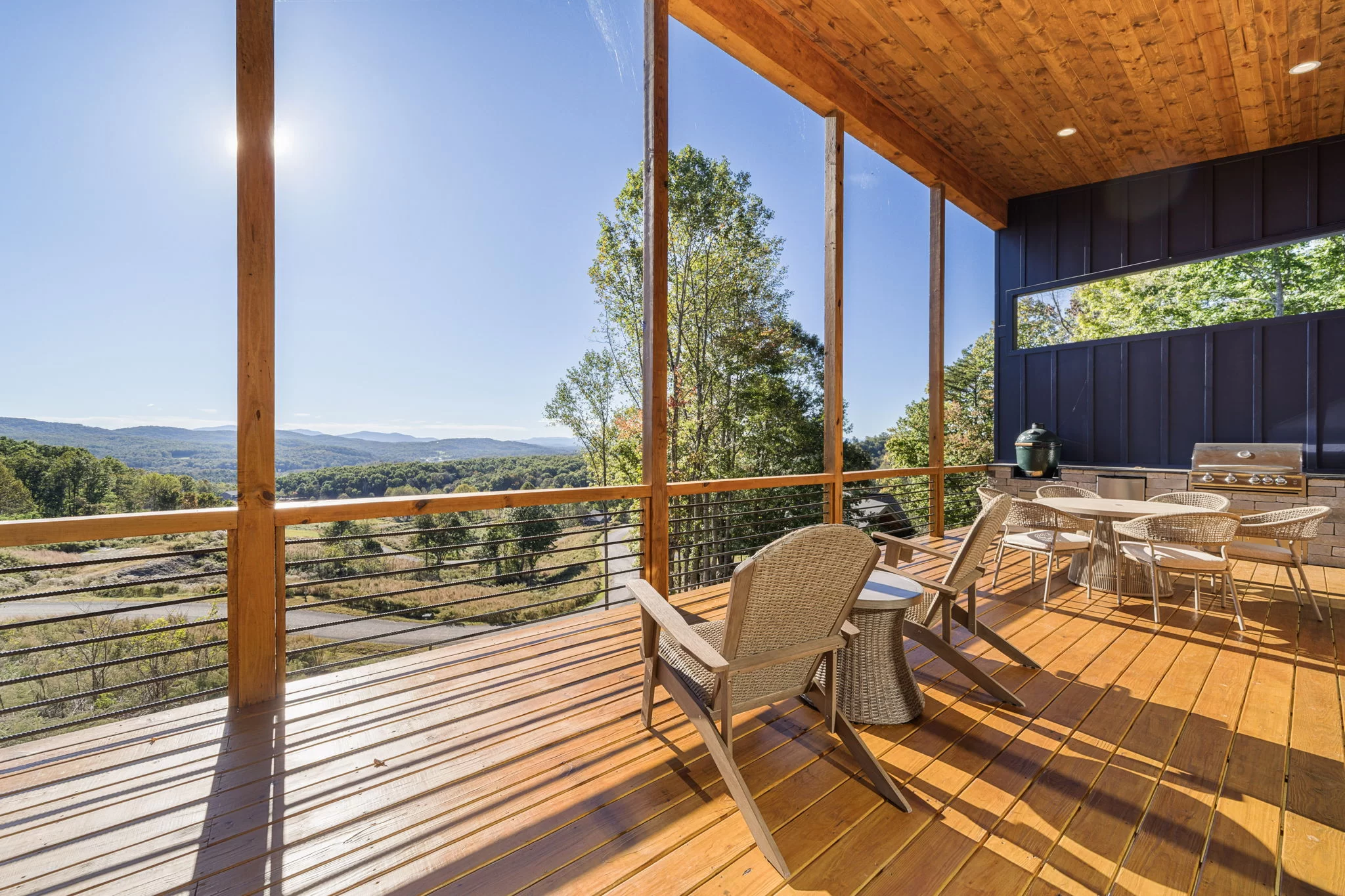 Covered deck with chairs facing long-range mountain views, View Finder II