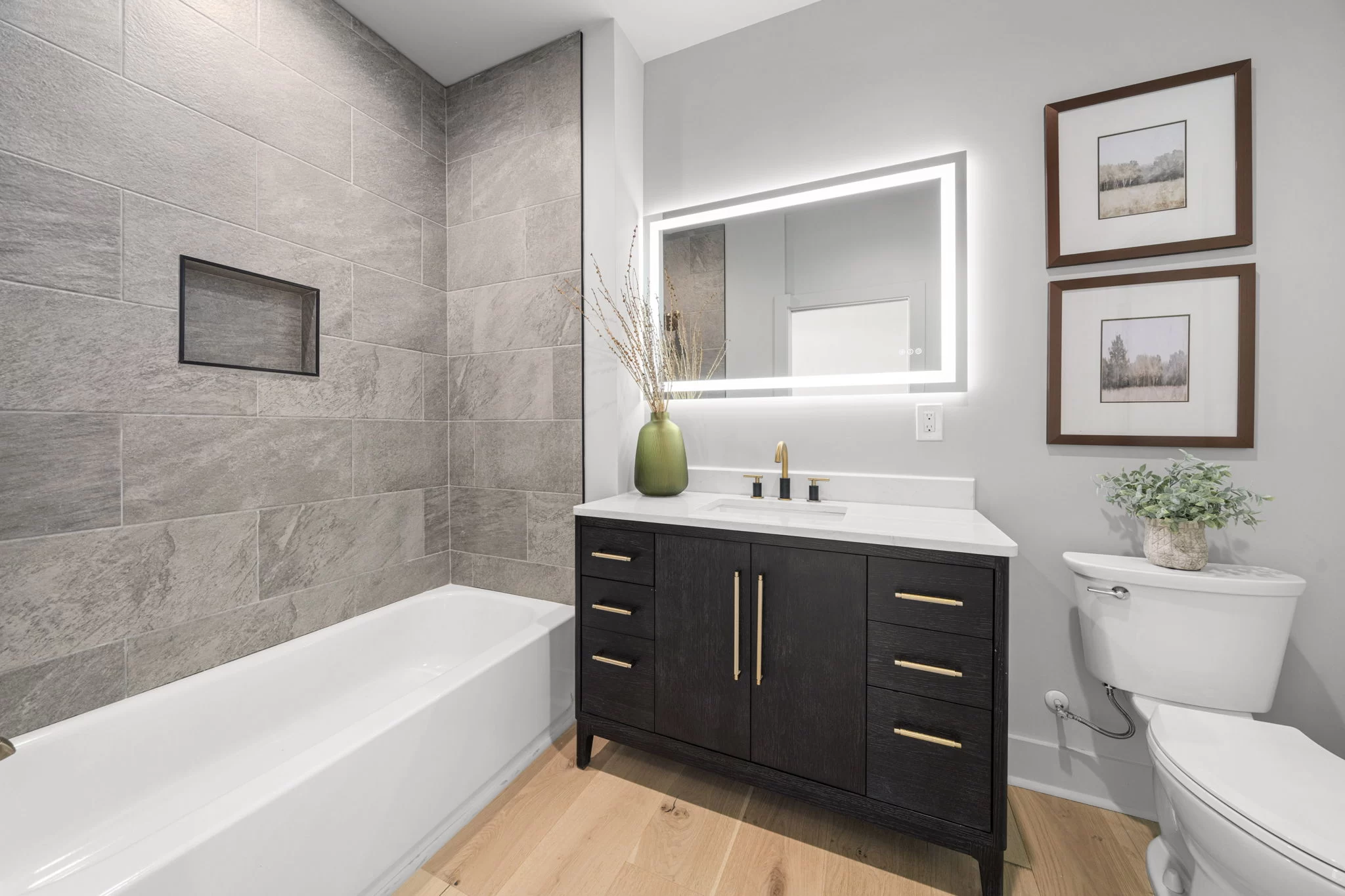 Bathroom with a tub and dark vanity, View Finder II