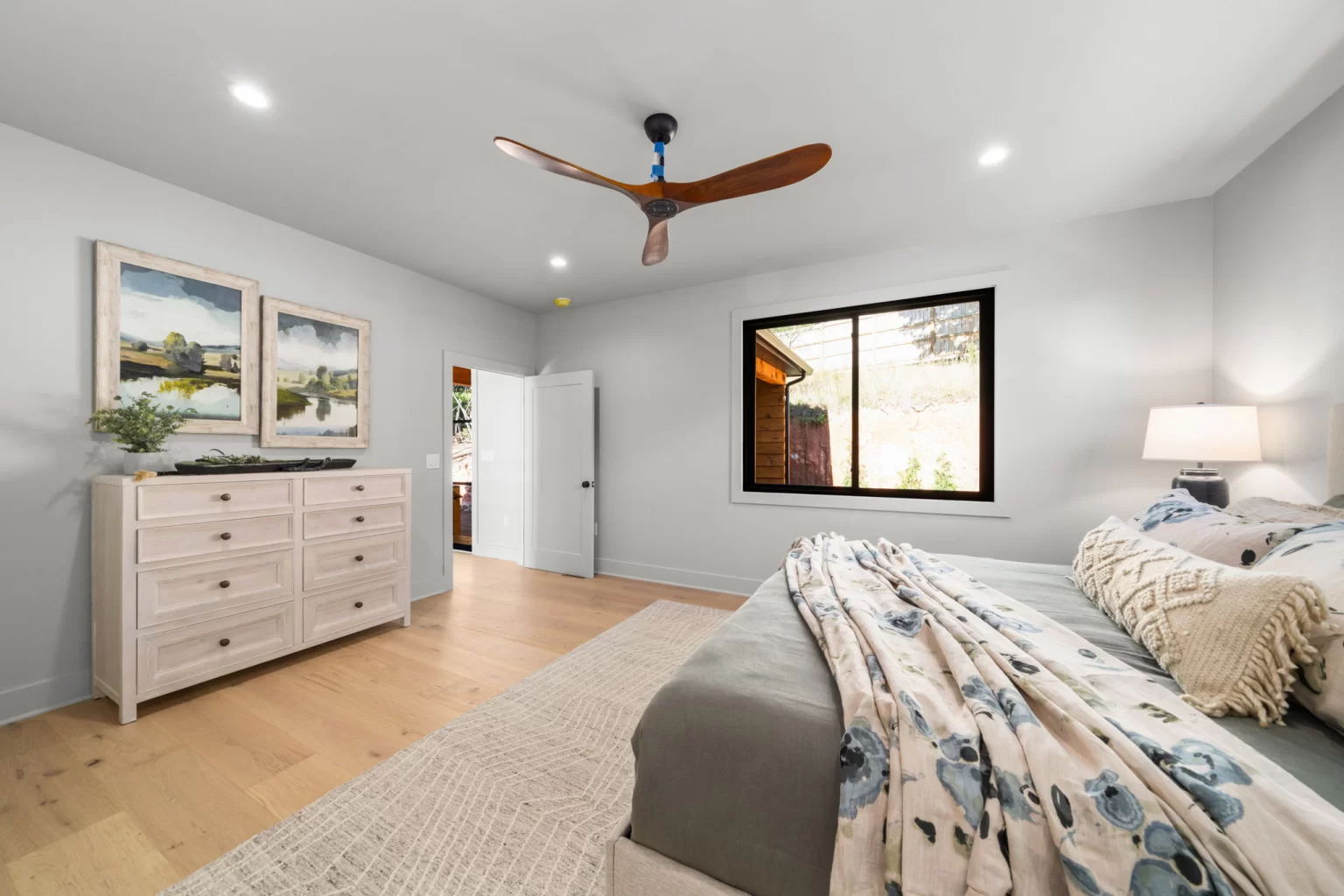 Bedroom with a dresser and a window to the mountains, View Finder II